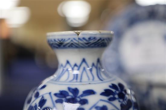 A Chinese blue and white tea bowl and saucer and two jars, Kangxi, some damage, largest diameter 11cm